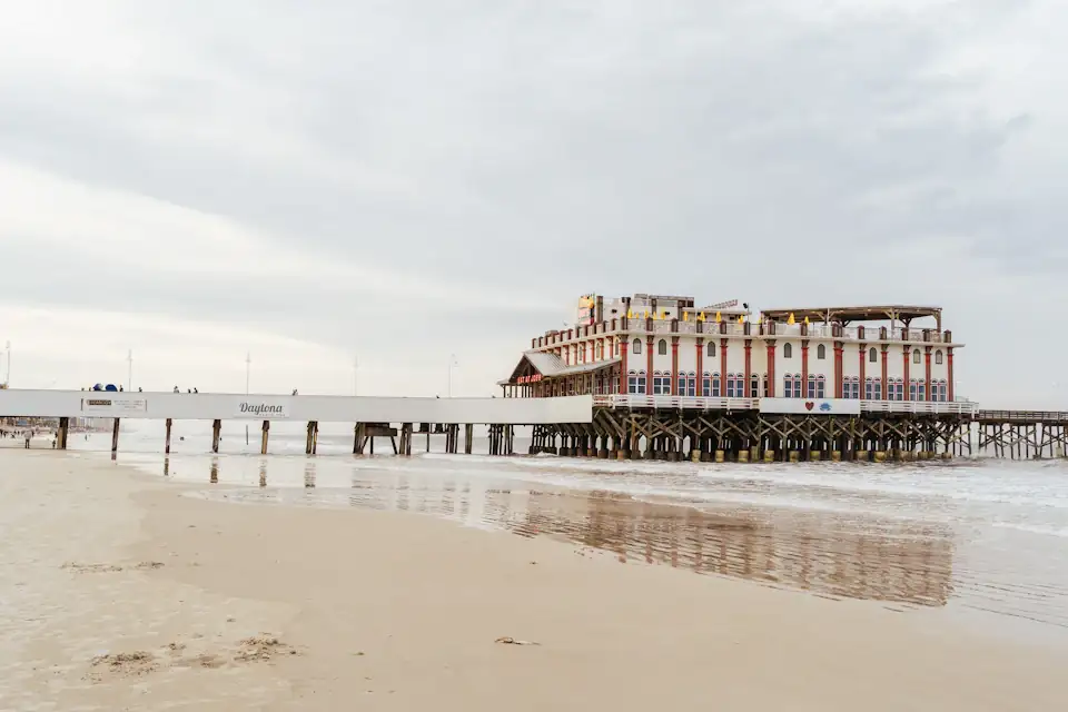 The historic pier and wide hard-packed beach at Daytona Beach, Florida