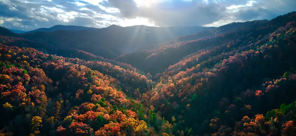 Sunbeams over the autumn ridgelines of the Great Smoky Mountains near Gatlinburg, Tennessee