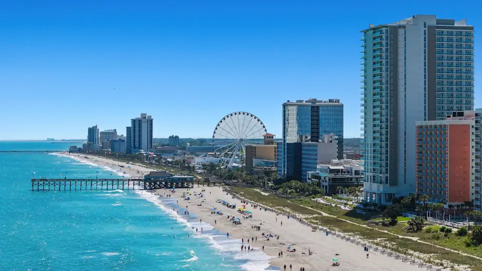 Aerial view of the Myrtle Beach skyline, SkyWheel, and pier along the Grand Strand